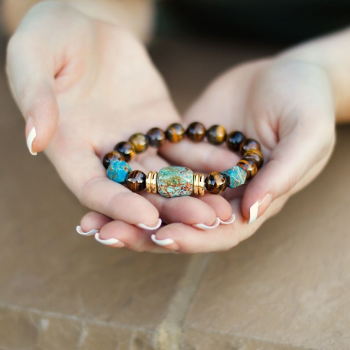 hands holding a bracelet